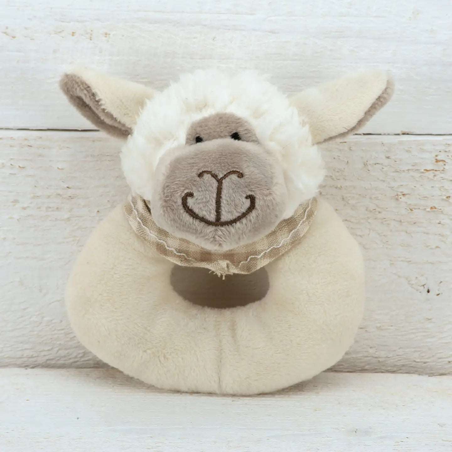 Adorable Jomanda stuffed sheep toy with a charming bow, designed as a ring rattle for babies to enjoy. 