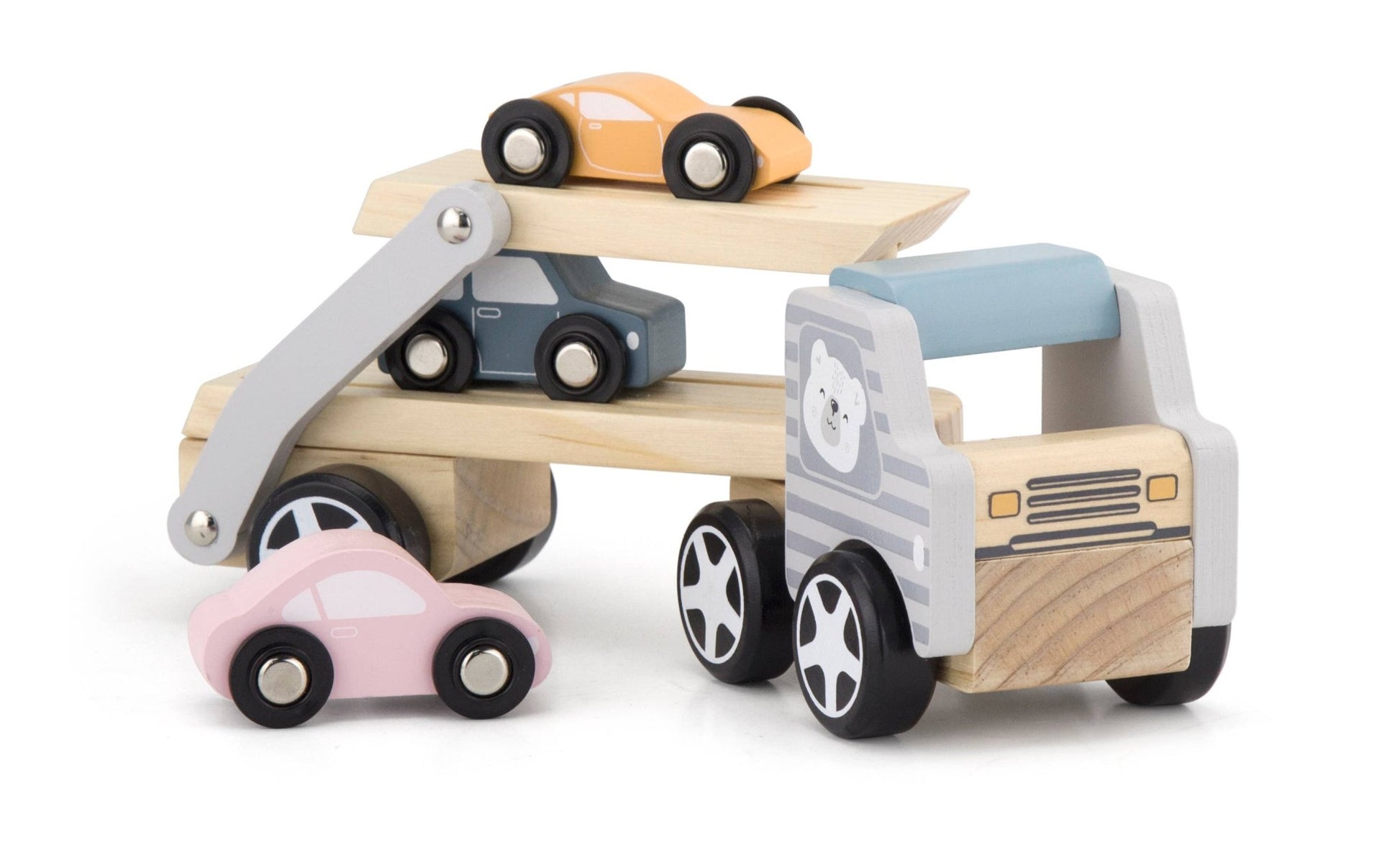 A wooden toy car transporter made by PolarB, featuring a light brown carrier truck with a gray-striped cab, an illustrated bear on the side, and a movable two-level ramp. The set includes three small wooden toy cars in pastel yellow, pink, and blue, designed to be loaded onto the carrier.